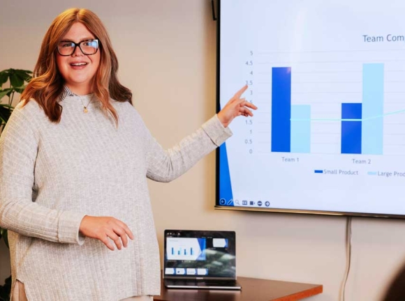 woman pointing at screen